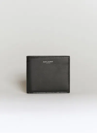 Saint Laurent Logo Embossed Bi-fold Wallet In Black
