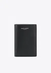 Saint Laurent Logo Embossed Bi-fold Wallet In Grained Leather In Black