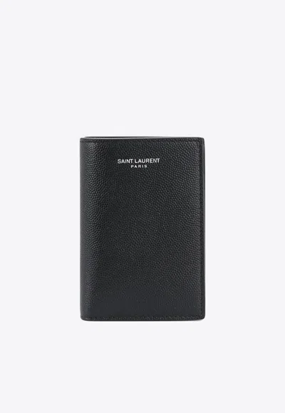 Saint Laurent Logo Embossed Bi-fold Wallet In Grained Leather In Black