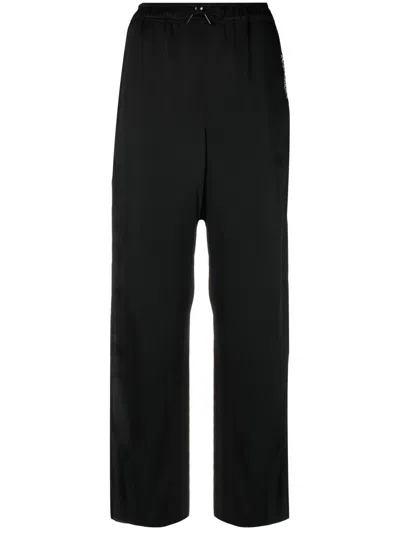 Saint Laurent Cropped-hose Mit Logo-stickerei In Black
