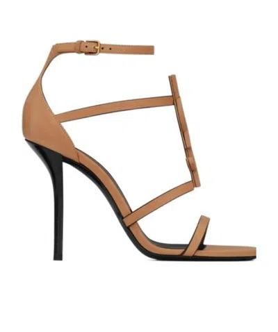 SAINT LAURENT CASSANDRA SANDALS IN VEGETABLE-TANNED LEATHER WITH BROWN GOLD MONOGRAM