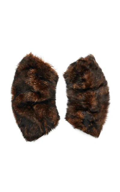 Saint Laurent Long Shearling Muffs In Brown