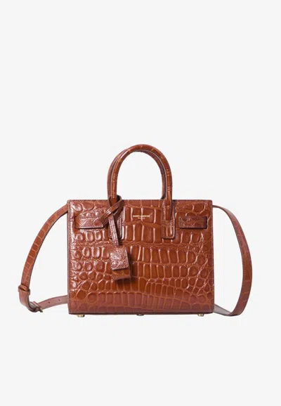 Saint Laurent Nano Sac De Jour Top Handle Bag In Croc-embossed Leather In Pink
