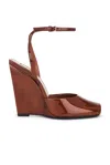 Saint Laurent La Scandale Patent-leather Wedge Sandals In Fluffy Chataigne