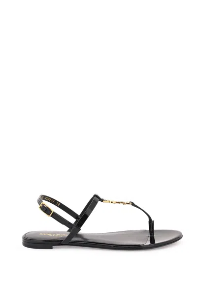 SAINT LAURENT PATENT LEATHER CASSANDRA FLAT SANDALS