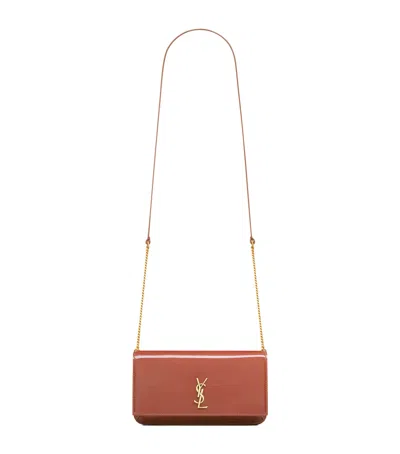 Saint Laurent Patent Leather Cassandre Phone Holder In Pink