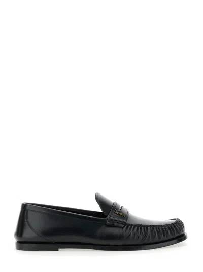 SAINT LAURENT SAINT LAURENT 'PENNY' BLACK LOAFERS WITH METAL CASSANDRE LOGO AND CURLED TOE IN LEATHER MAN