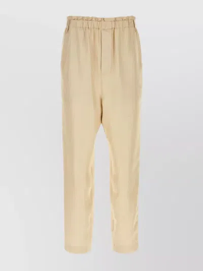 Saint Laurent Trousers With Front Pleats And Back Pockets In Stripped