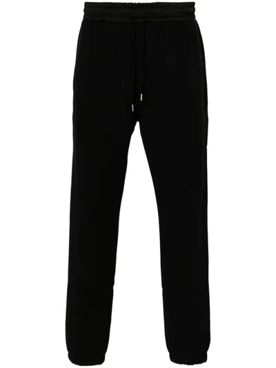 SAINT LAURENT SAINT LAURENT RELAXED COTTON TROUSERS WITH ELASTIC WAISTBAND AND TAPERED CUFFS