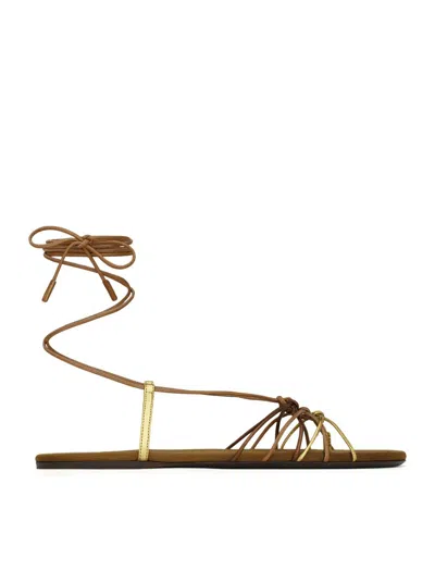 Saint Laurent Cassandre Leather Flat Strappy Sandals In Gold