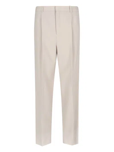 Saint Laurent Trousers With Front Pleats And Back Pockets In Stripped