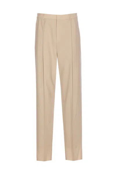 Saint Laurent Trousers With Front Pleats And Back Pockets In Stripped