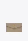 Saint Laurent Uptown Cassandre Clutch Bag In Sand