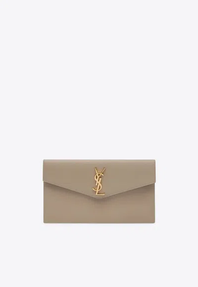 Saint Laurent Uptown Cassandre Clutch Bag In Sand