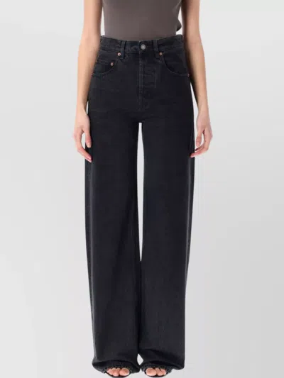 SAINT LAURENT WIDE-LEG FIVE-POCKET DENIM TROUSERS