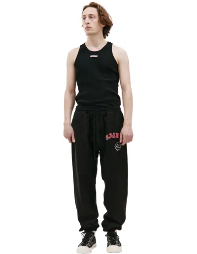 Saint Michael Logo Printed Sweatpants In Black