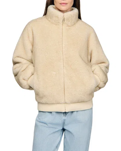 Sandro Babel Faux Fur Jacket In Sand