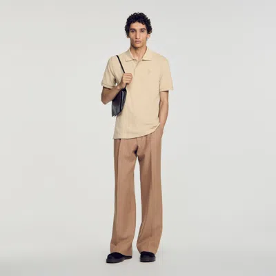 Sandro Cotton Polo Shirt With Leather Logo In Sand