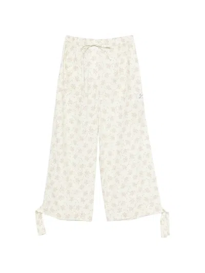 Sandro Davi Floral-print Tie-detail Trousers In Neutral