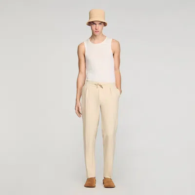 Sandro Elasticated Straight-leg Trousers In Brown