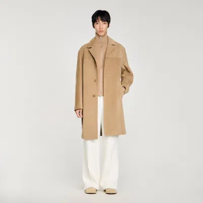 Sandro Long Belted Leather Coat In Brown