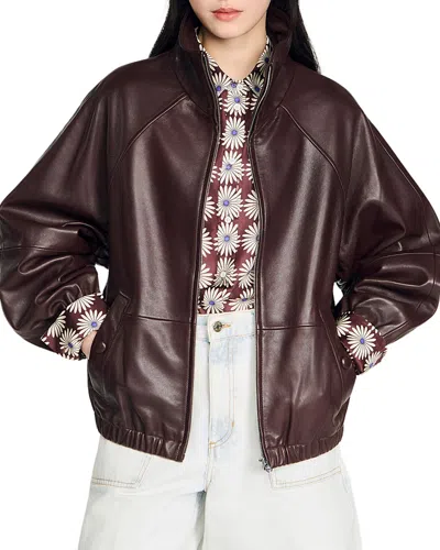 Sandro Oversized Zip Up Leather Jacket In Brown