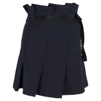 Sandro Pleated Bow Mini Skirt In Navy Blue Polyester