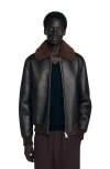 Sandro Reversed Leather Jacket In Black