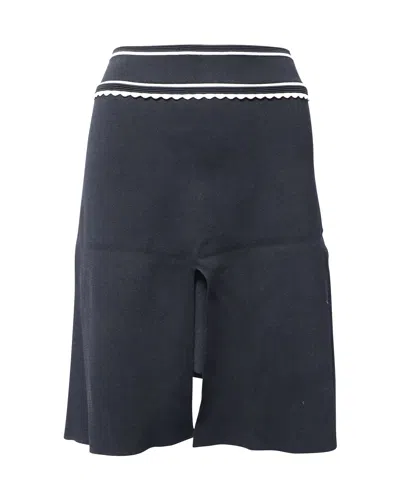 Sandro Ribbed Knee Length Skirt In Black Polyester