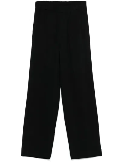 Sandro Ribbed Trousers In Black