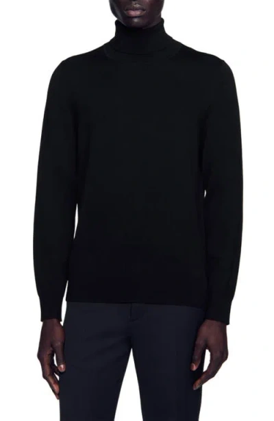 Sandro Roll Neck Wool Sweater In Black