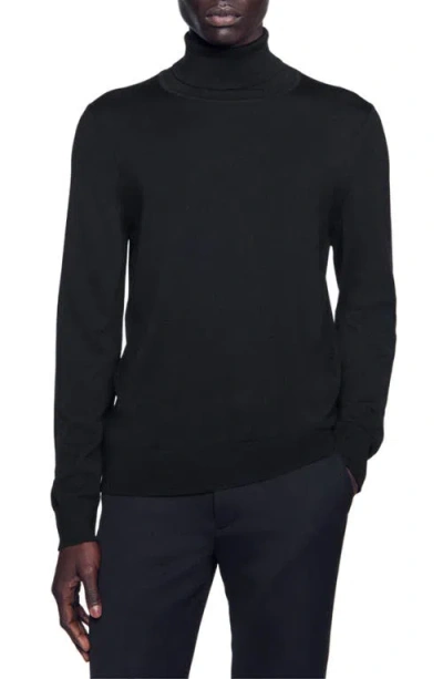 Sandro Roll Neck Wool Sweater In Navy Blue