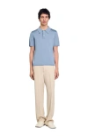 Sandro Short-sleeve Knitted Polo Shirt In Chambray.