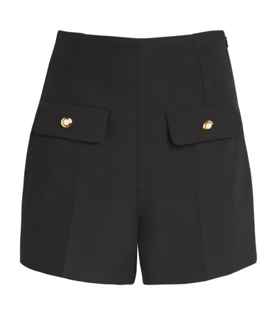 Sandro Twin-flap Mini Skirt In Black