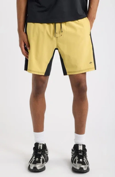 Santo Studio Tempo Wordmark Performance Shorts In Gold