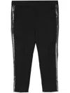 Sapio Pressed-crease Wool Tapered Trousers In Black