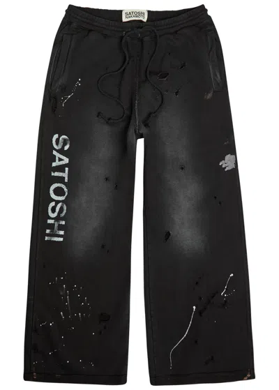 Satoshi Nakamoto Luke Printed Distressed Wide-leg Cotton Sweatpants In Black