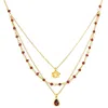 Satya Jewelry Embrace Change Garnet Lotus Triple Necklace In Gold