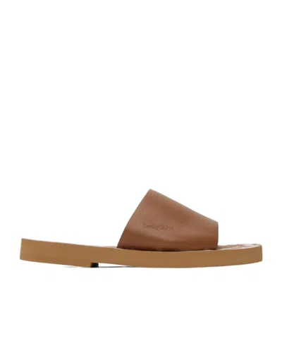 See By Chloé Logo Embossed Slippers In Brown