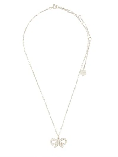 Self-portrait Charming Bow Pendant Necklace In Polished Brass In Metallic