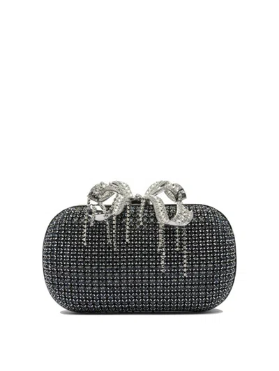 Self-portrait Clutches
