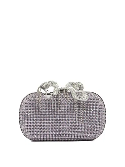 Self-portrait Clutches