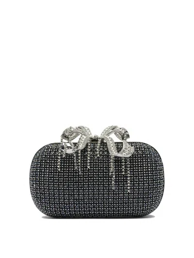 Self-portrait Clutches In Blue