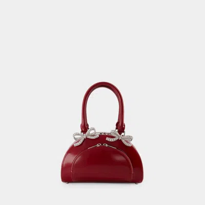 Self-portrait Womens Burgundy Bow-embellished Curved Leather Tote Bag