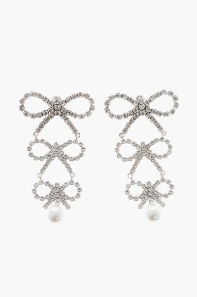 Self-portrait Dangling Rhinestone Earrings With A Triple Bow Design In Silver