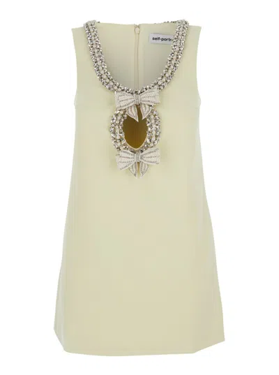 Self-portrait Yellow Crewneck Mini Dress With Jewel Embellishment On The Collar And Bow Detail On The Front In Nude