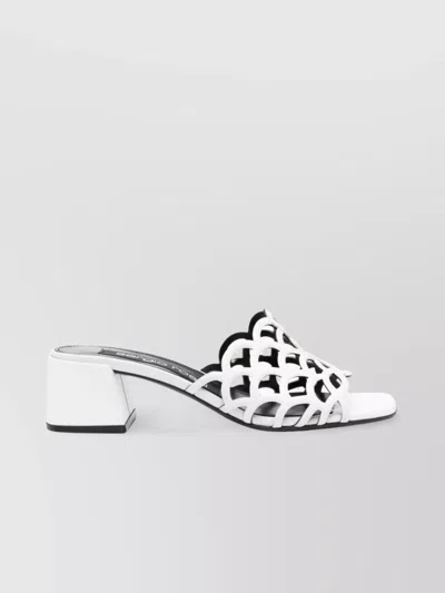 SERGIO ROSSI LOW BLOCK HEEL MULES WITH OPENWORK DETAIL
