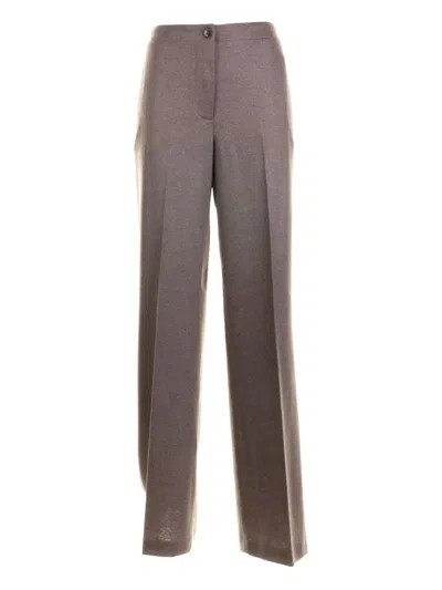 SEVENTY BUTTON-FASTENING TROUSERS