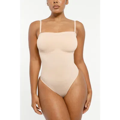 Shapellx Skin Flow Strapless Sculpt Thong Bodysuit In Neutral