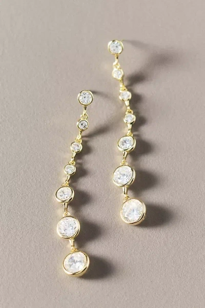 Shashi Graduated Crystal Bezel Drop Earrings In Gold